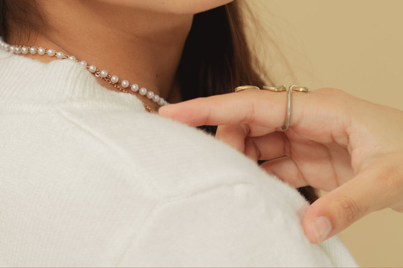 Aretes y pulsera de perlas